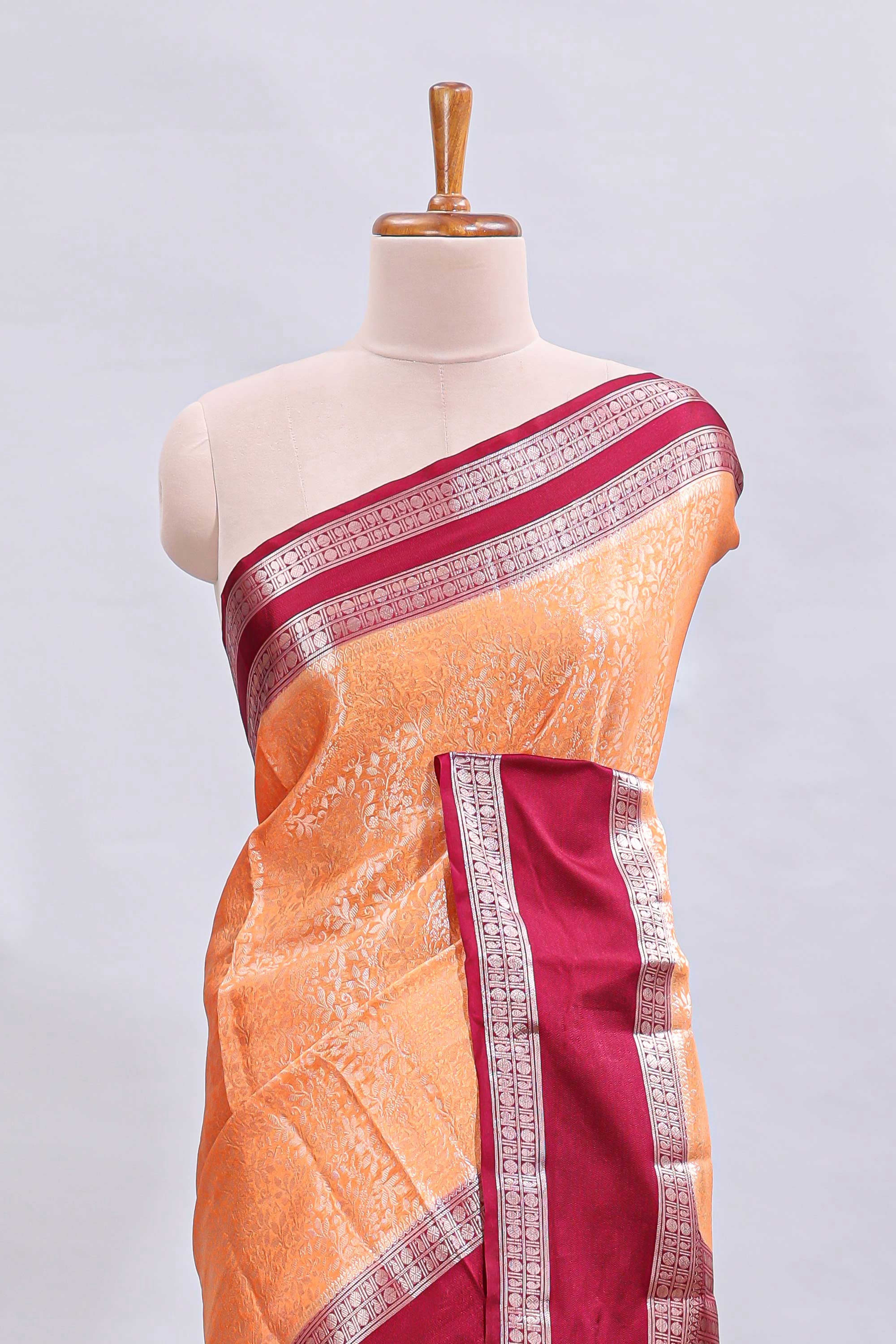 Orange jaal floral design mushru silk saree with contrast border and contrast blouse