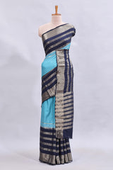 Blue zari design mushru silk saree with contrast striped zari border and blouse