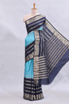 Blue zari design mushru silk saree with contrast striped zari border and blouse