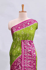 Green floral design mushru silk saree with contrast border and zari blouse