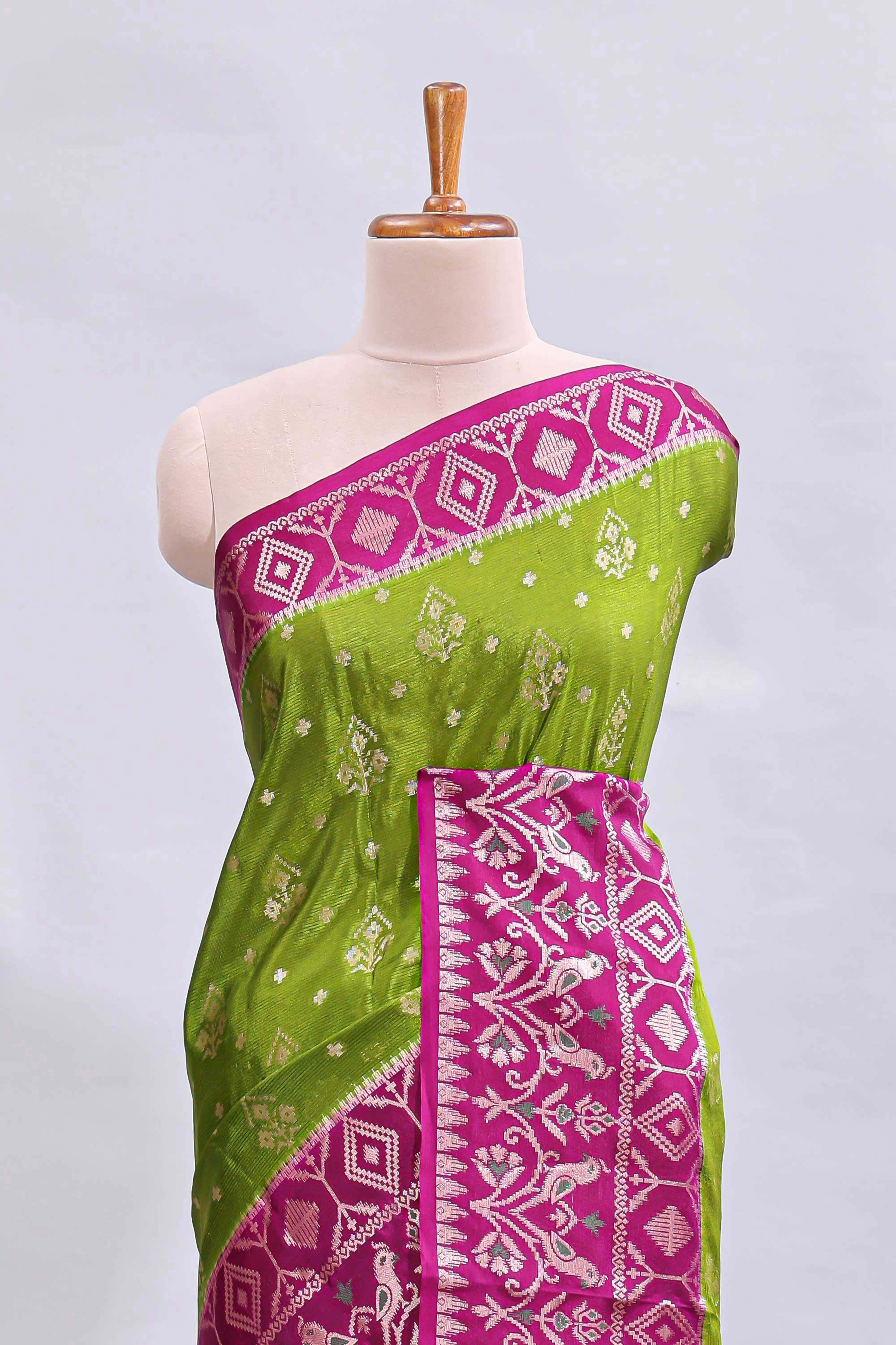Green floral design mushru silk saree with contrast border and zari blouse