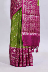 Green floral design mushru silk saree with contrast border and zari blouse