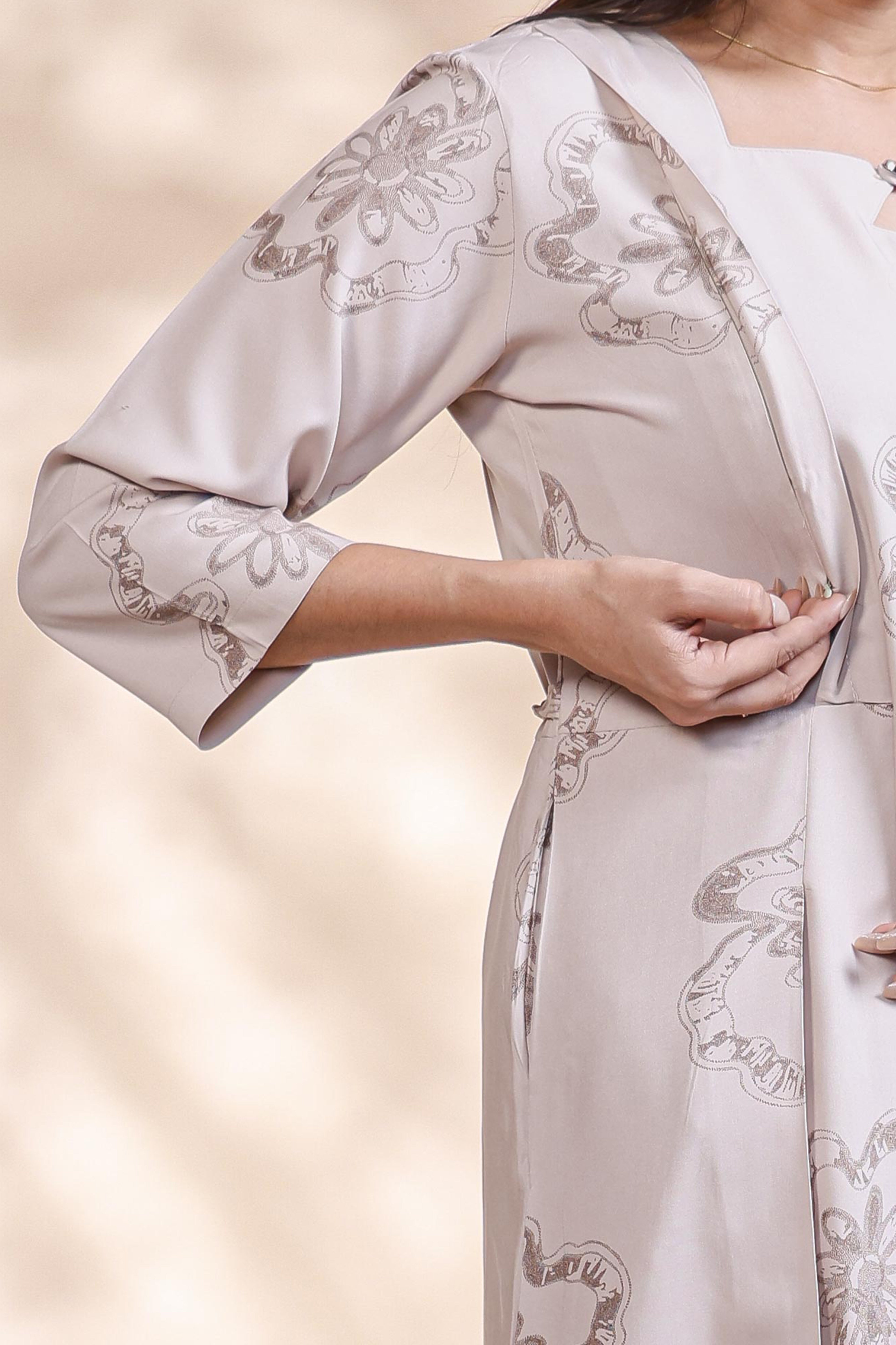 Beige floral printed A-line maternity wear with 3/4 sleeves and keyhole neck