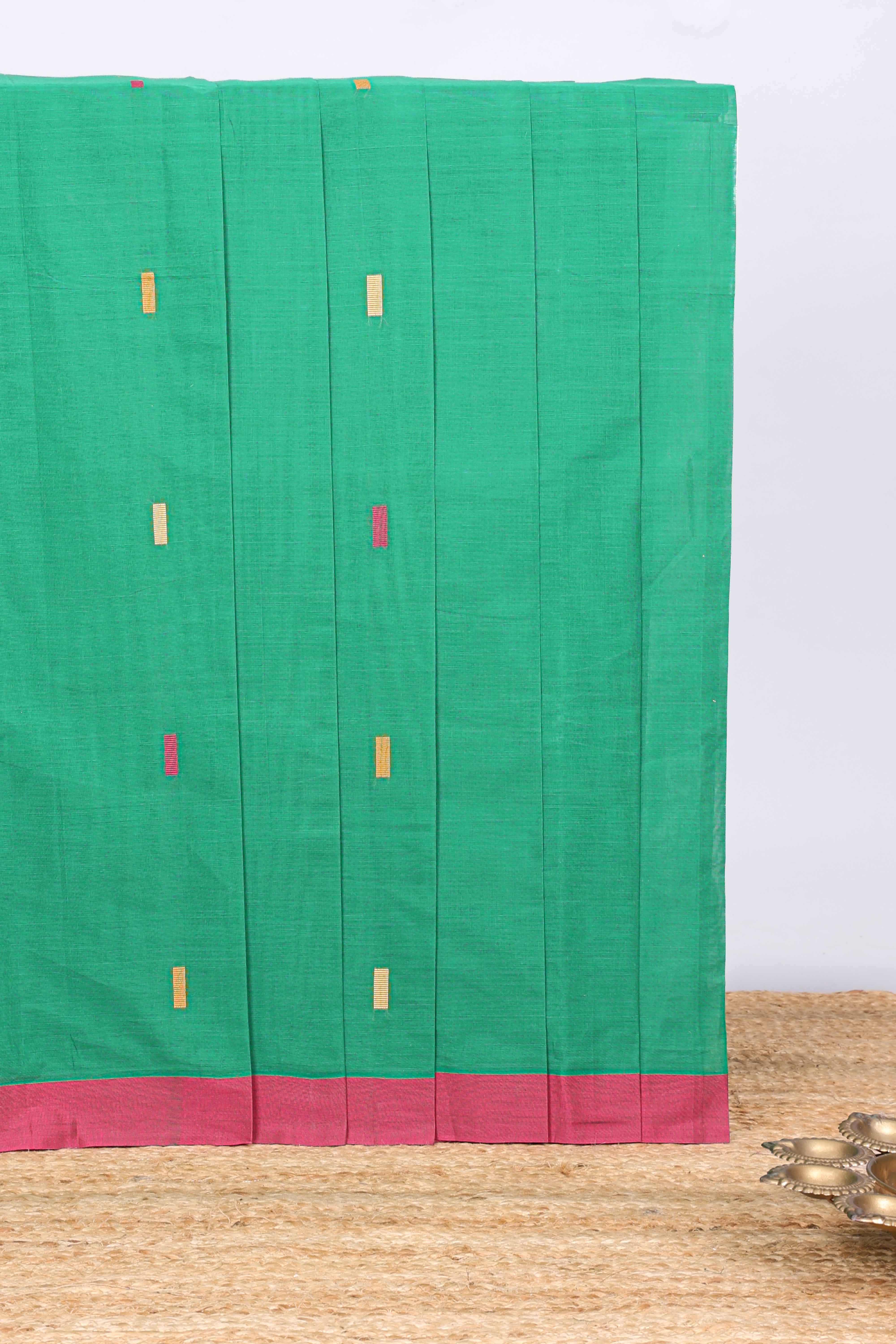 Green geometric butta narayanapet cotton saree with contrast border and crane birds & lotus design pallu