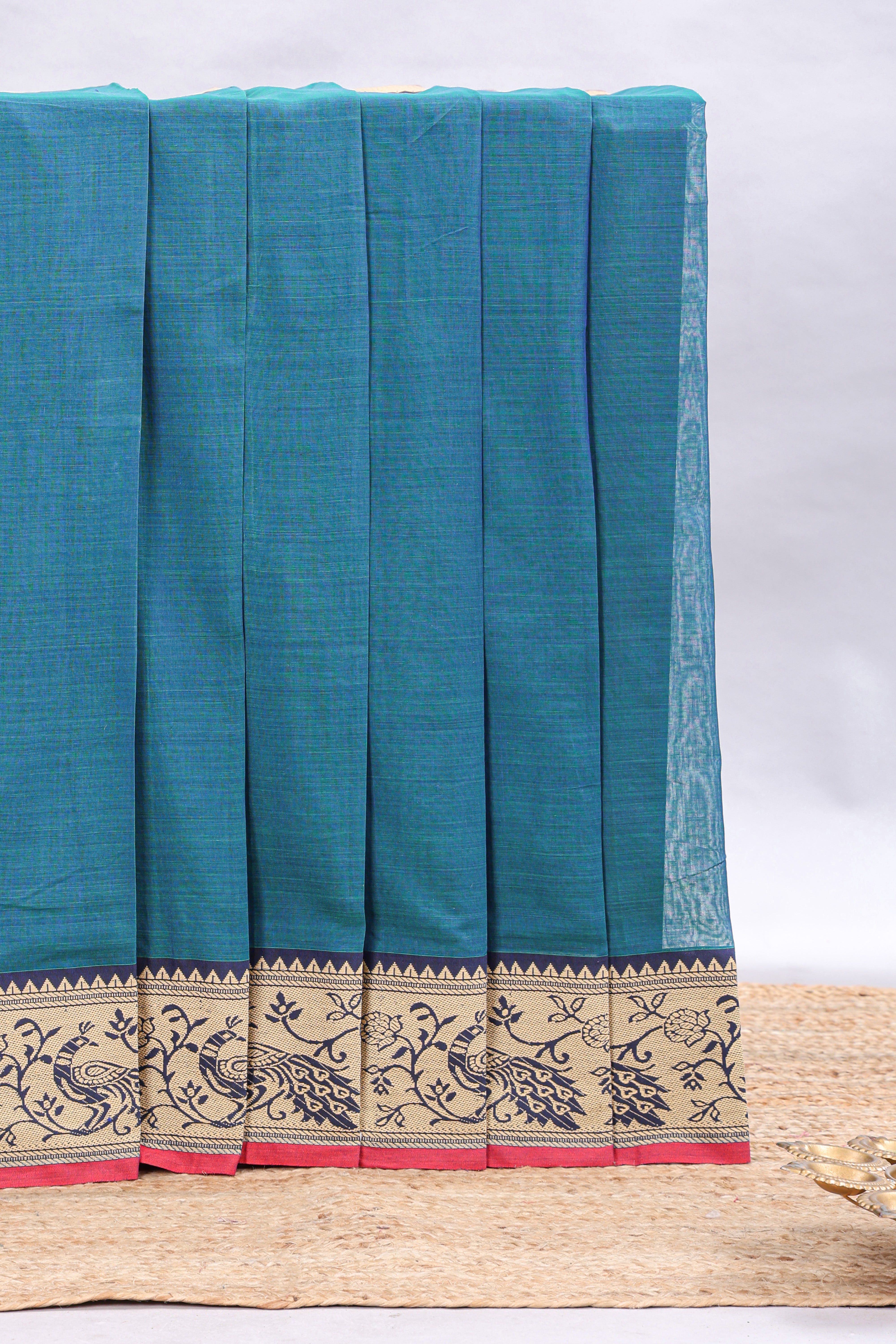 Teal blue plain narayanapet cotton saree with contrast peacock design border and matching blouse