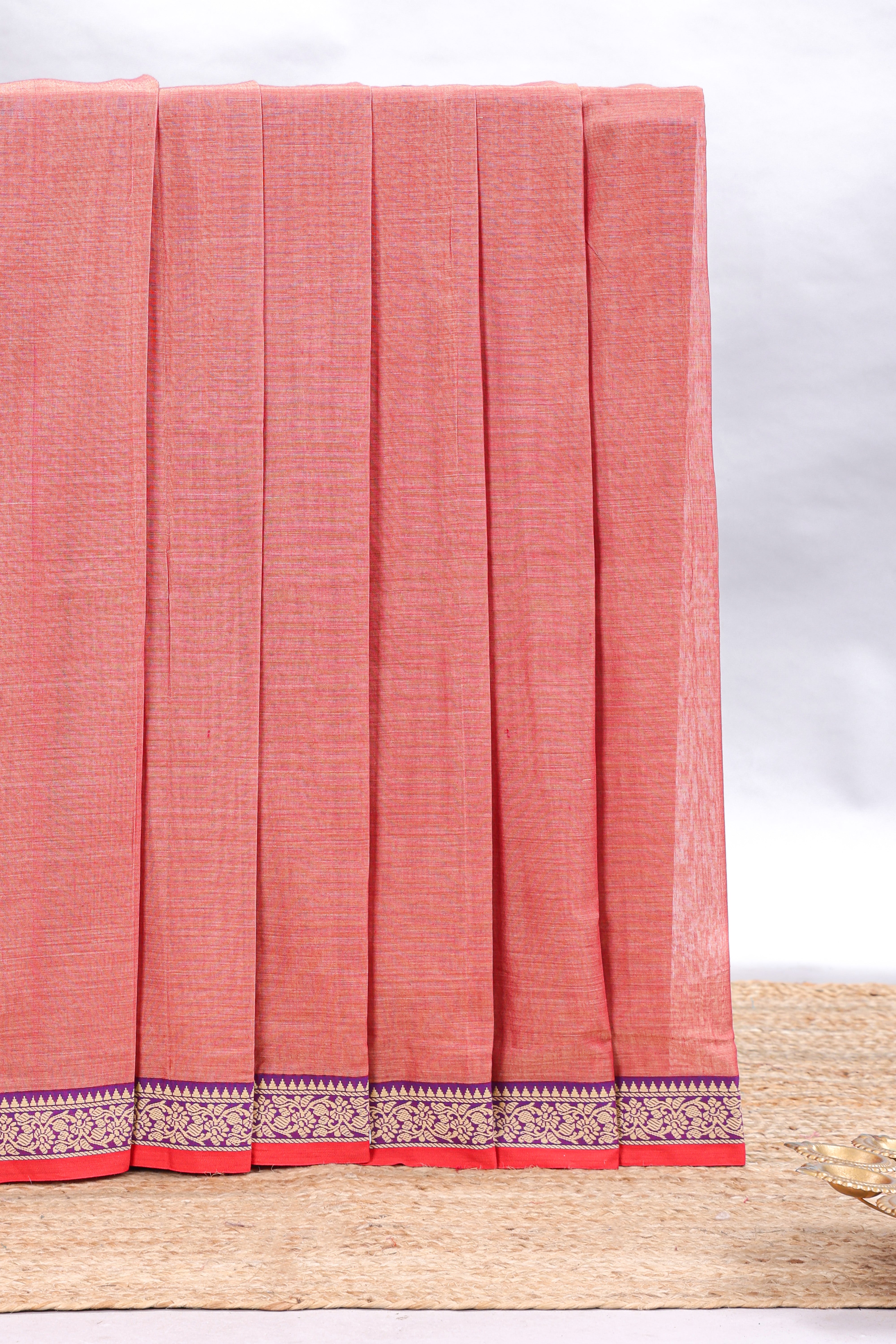 Peach plain narayanapet cotton saree with contrast floral design border and matching blouse