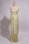 Pastel yellow organza saree featuring delicate floral embroidery intricate lace detailing on the border and pallu with a scalloped finishing along with matching blouse