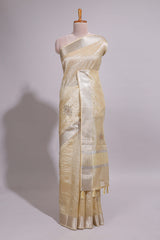 Cream organza saree featuring delicate floral embroidery intricate with silverborder along with blouse