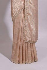 Ivory beige organza saree with plain body border and pallu with a scalloped finishing along with matching blouse