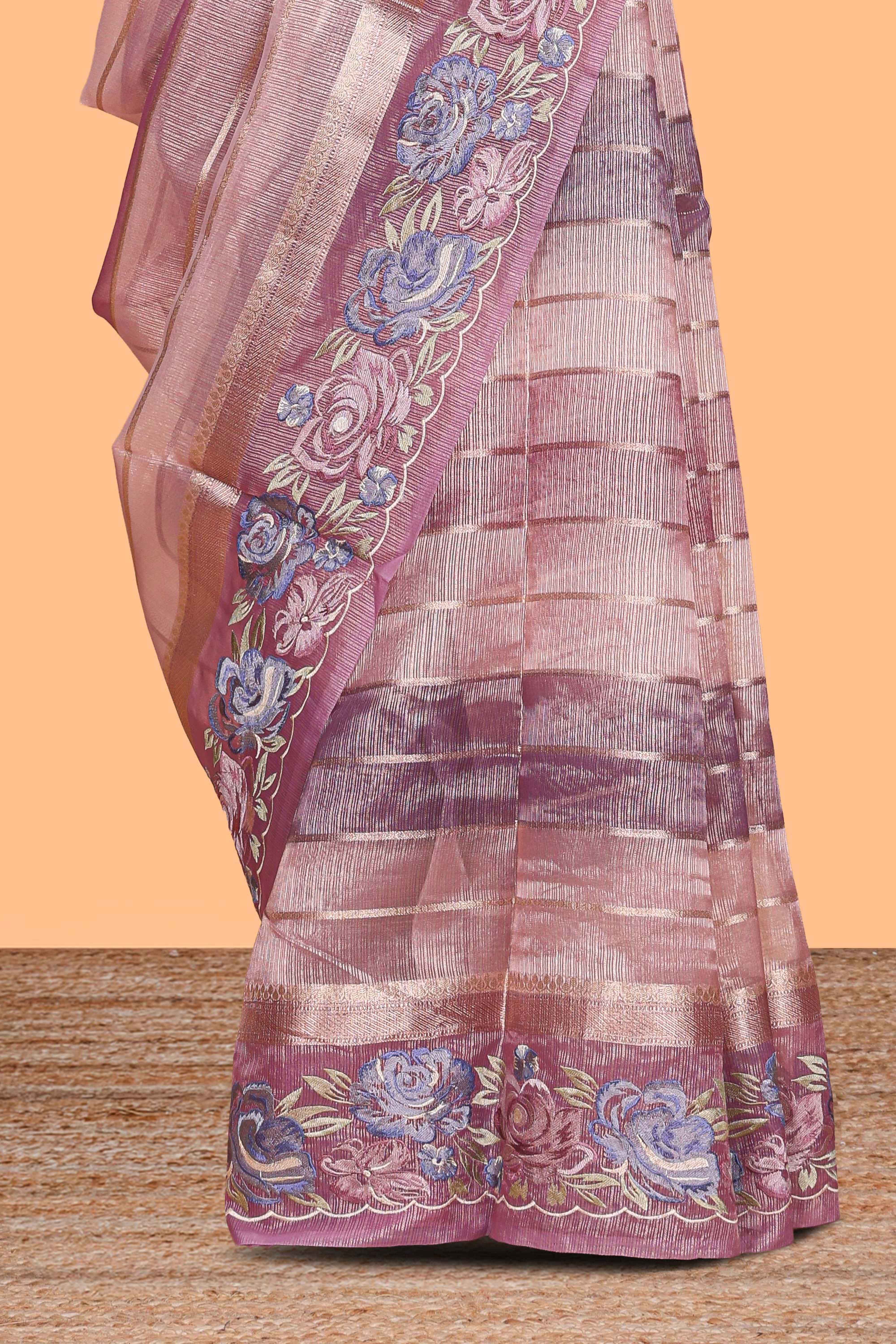 Peach striped design organza saree with floral design border and matching plain blouse