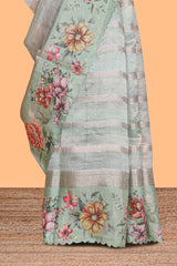 Green striped design organza saree with floral design border and matching floral motifs blouse