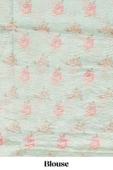 Green striped design organza saree with floral design border and matching floral motifs blouse