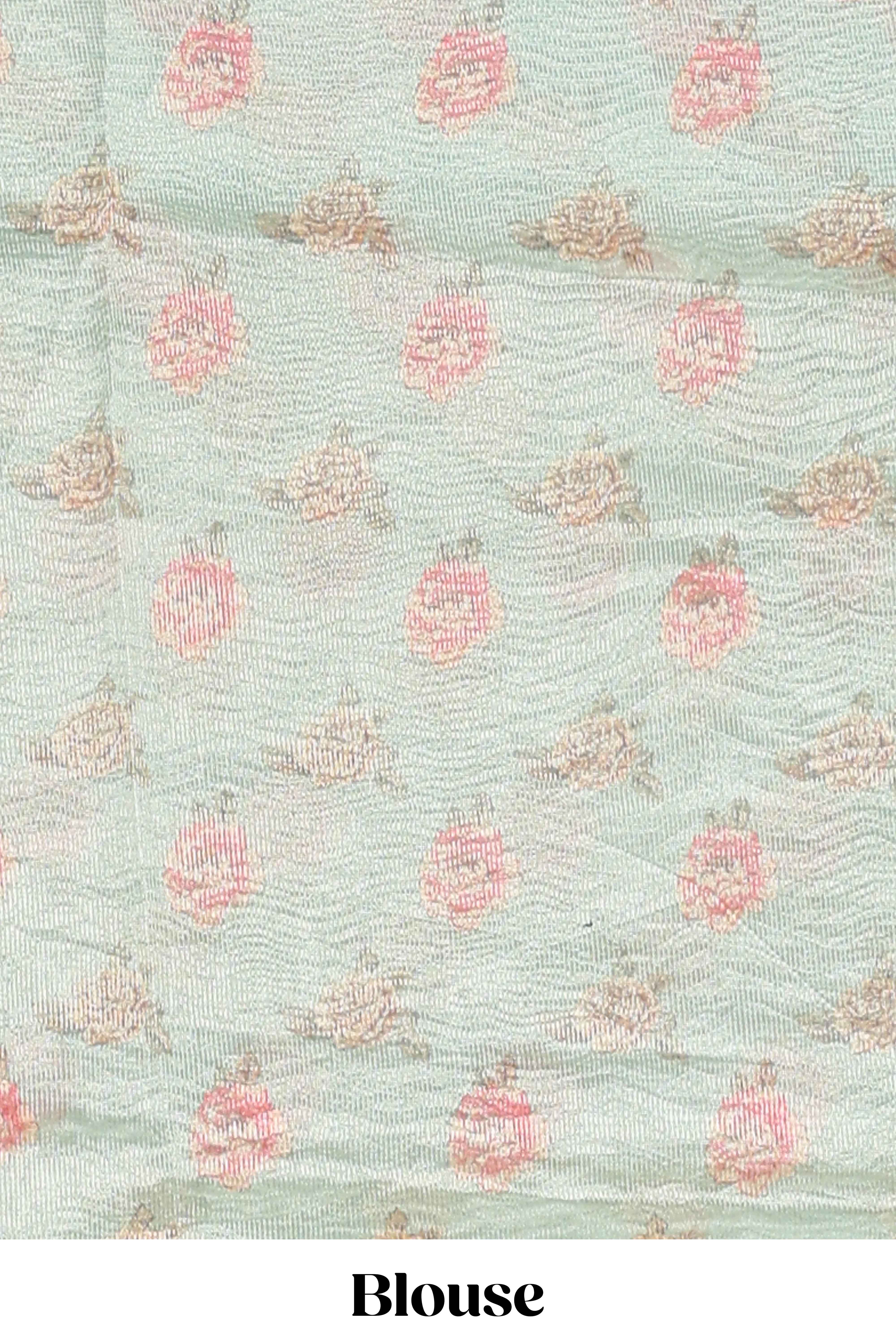 Green striped design organza saree with floral design border and matching floral motifs blouse