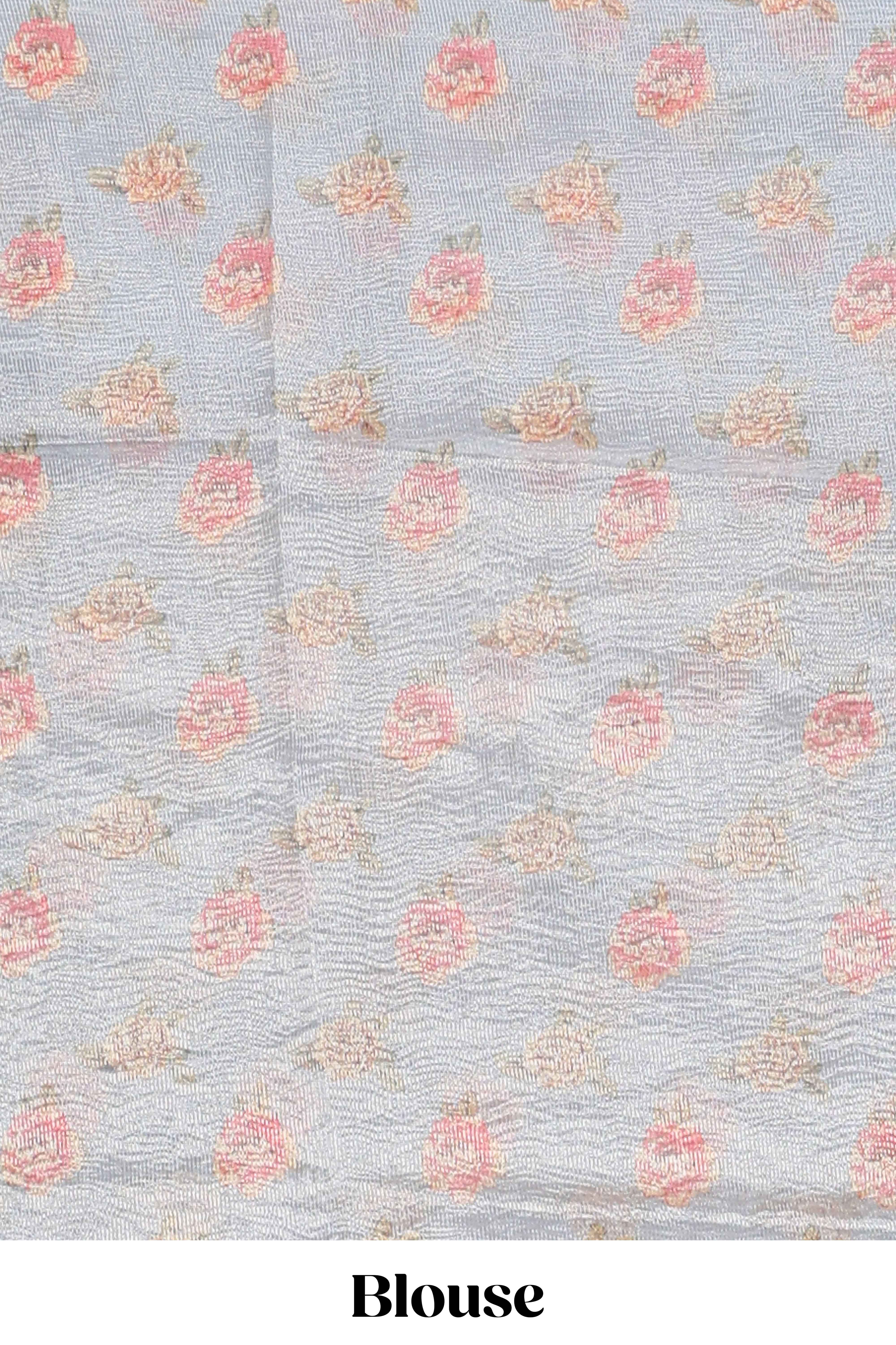 Grey shade striped design organza saree with floral design border and matching floral motifs blouse