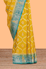 Yellow floral design banarasi silk saree with contrast border and floral printed blouse