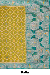 Yellow floral design banarasi silk saree with contrast border and floral printed blouse