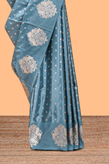 Blue floral motifs design banarasi silk saree with self zari border and matching floral printed blouse