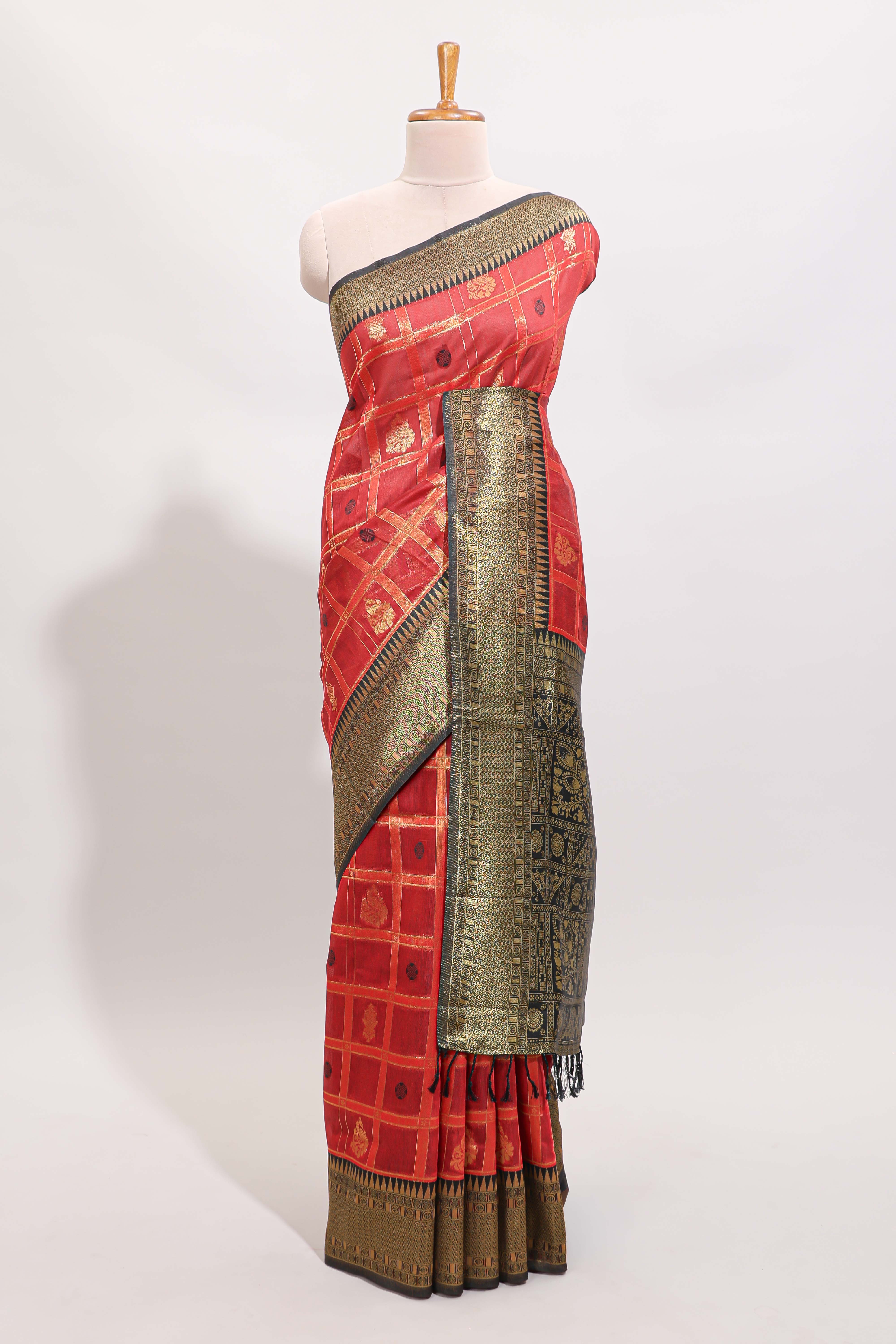Red shade checked and butta banarasi silk saree with black contrast geometric zari border and buttas blouse