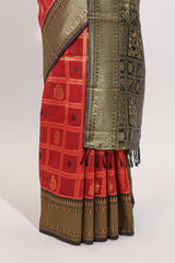 Red shade checked and butta banarasi silk saree with black contrast geometric zari border and buttas blouse