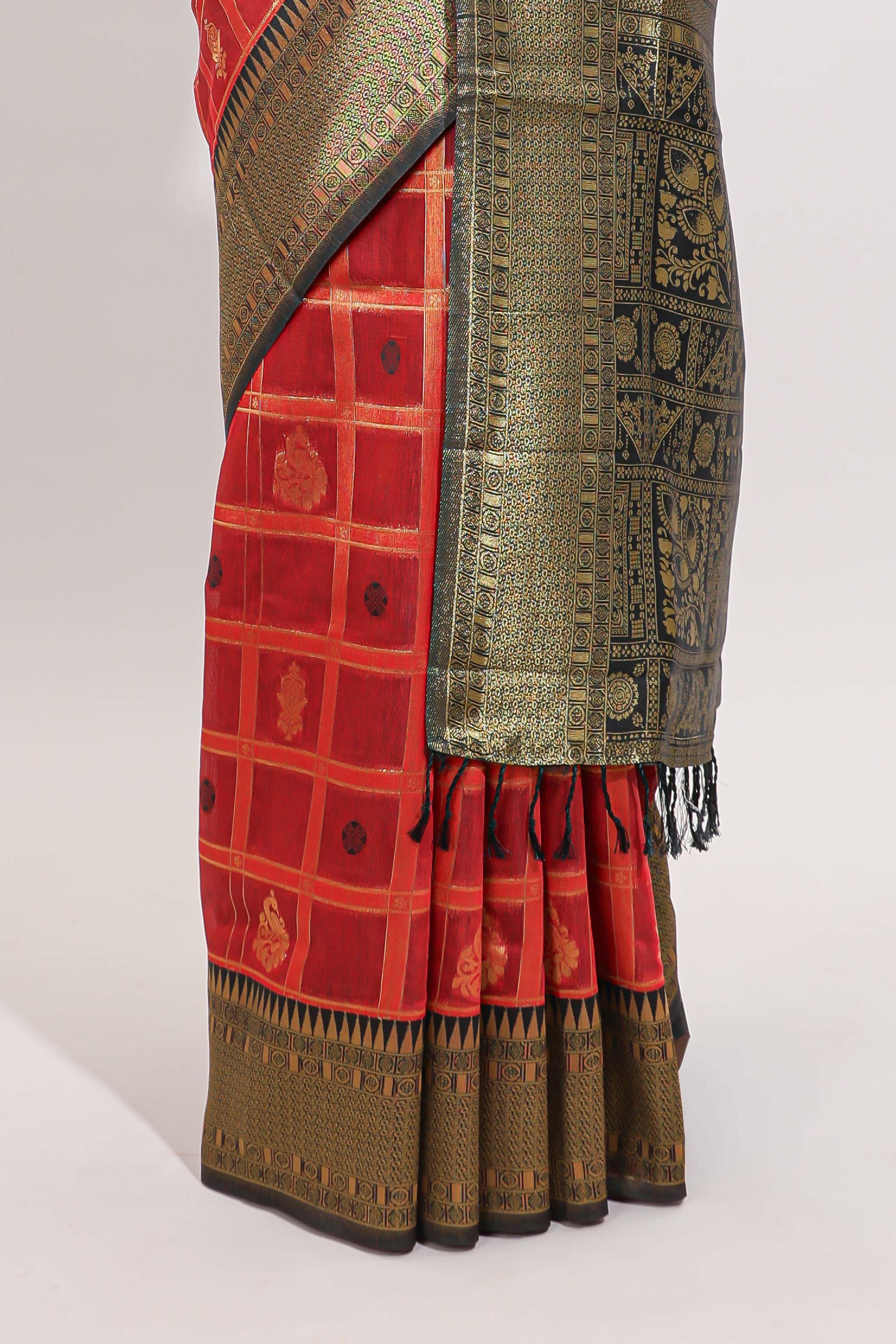 Red shade checked and butta banarasi silk saree with black contrast geometric zari border and buttas blouse