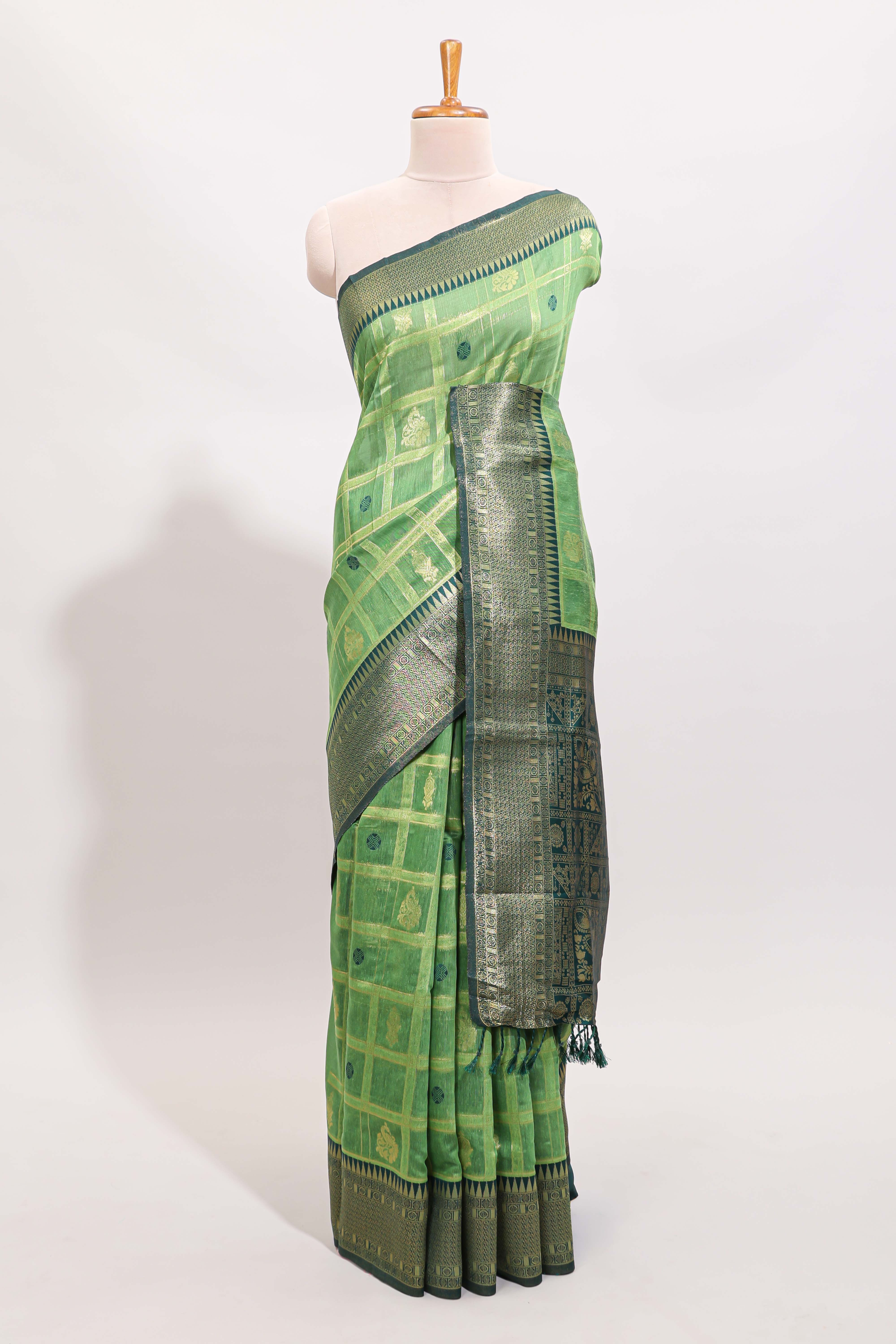 Green shade checked and butta banarasi silk saree with contrast geometric zari border and buttas blouse