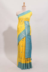 Yellow shade checked and butta banarasi silk saree with teal blue contrast zari border and buttas blouse