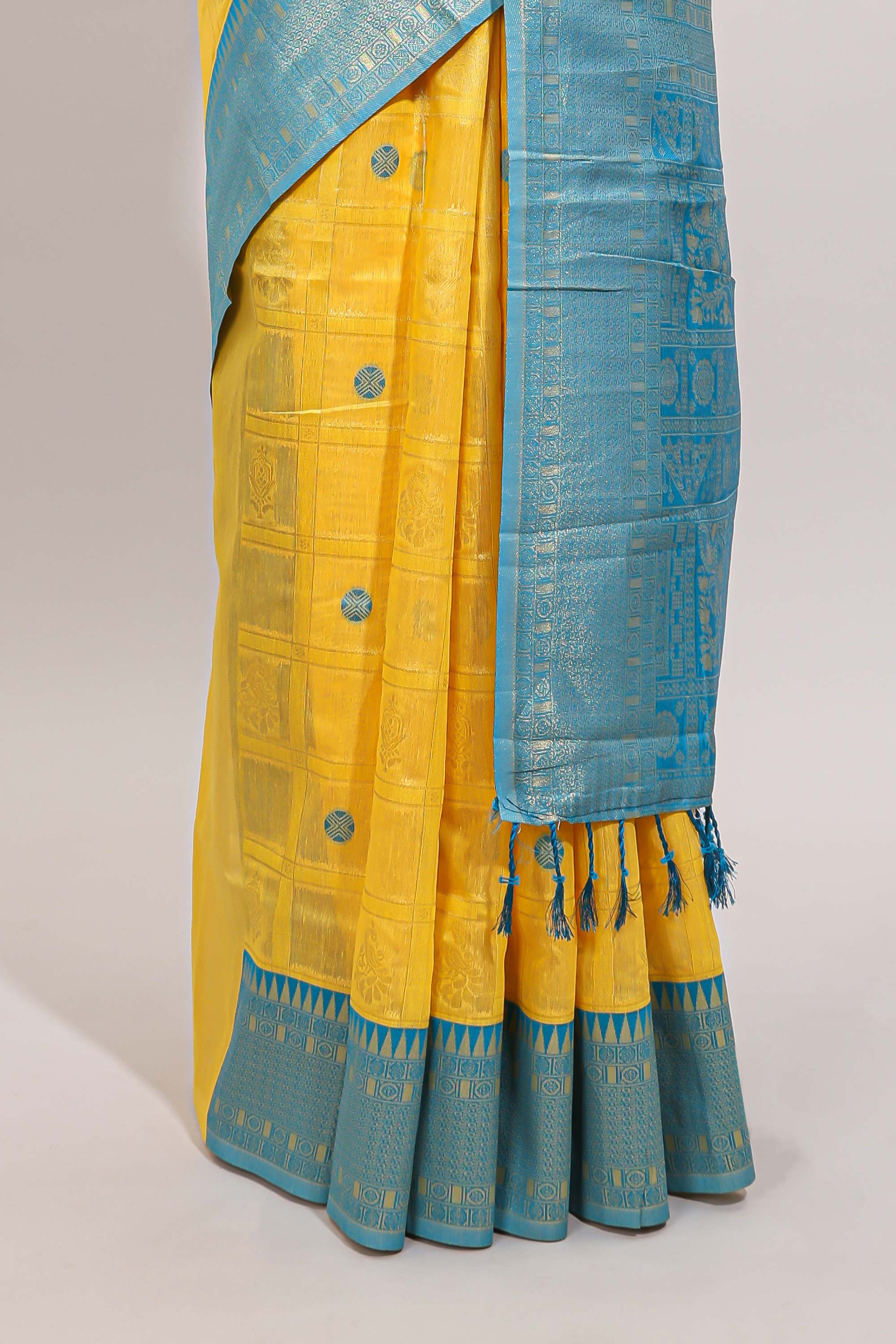 Yellow shade checked and butta banarasi silk saree with teal blue contrast zari border and buttas blouse