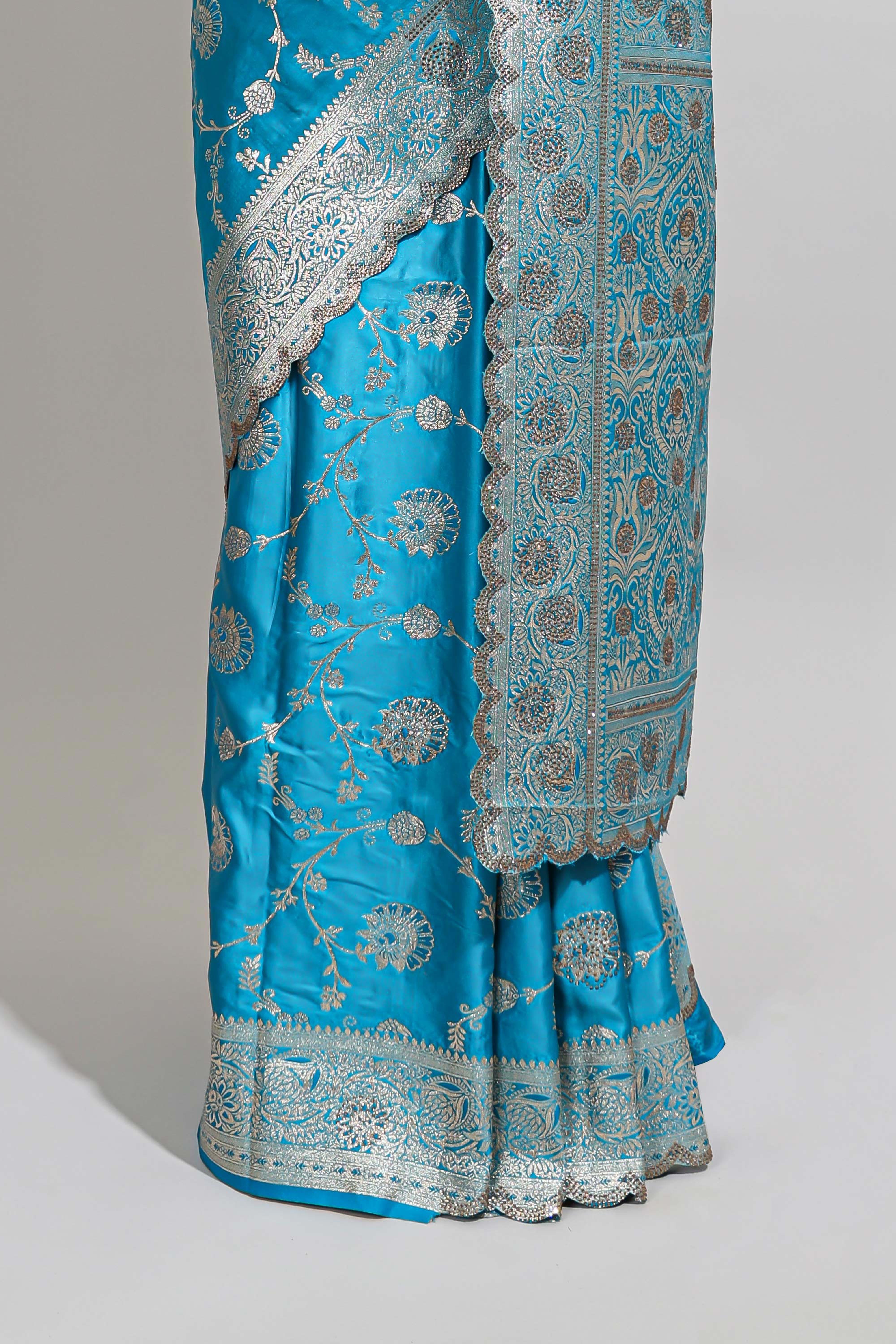 Blue shade floral designed banarasi silk saree with self zari border and blouse
