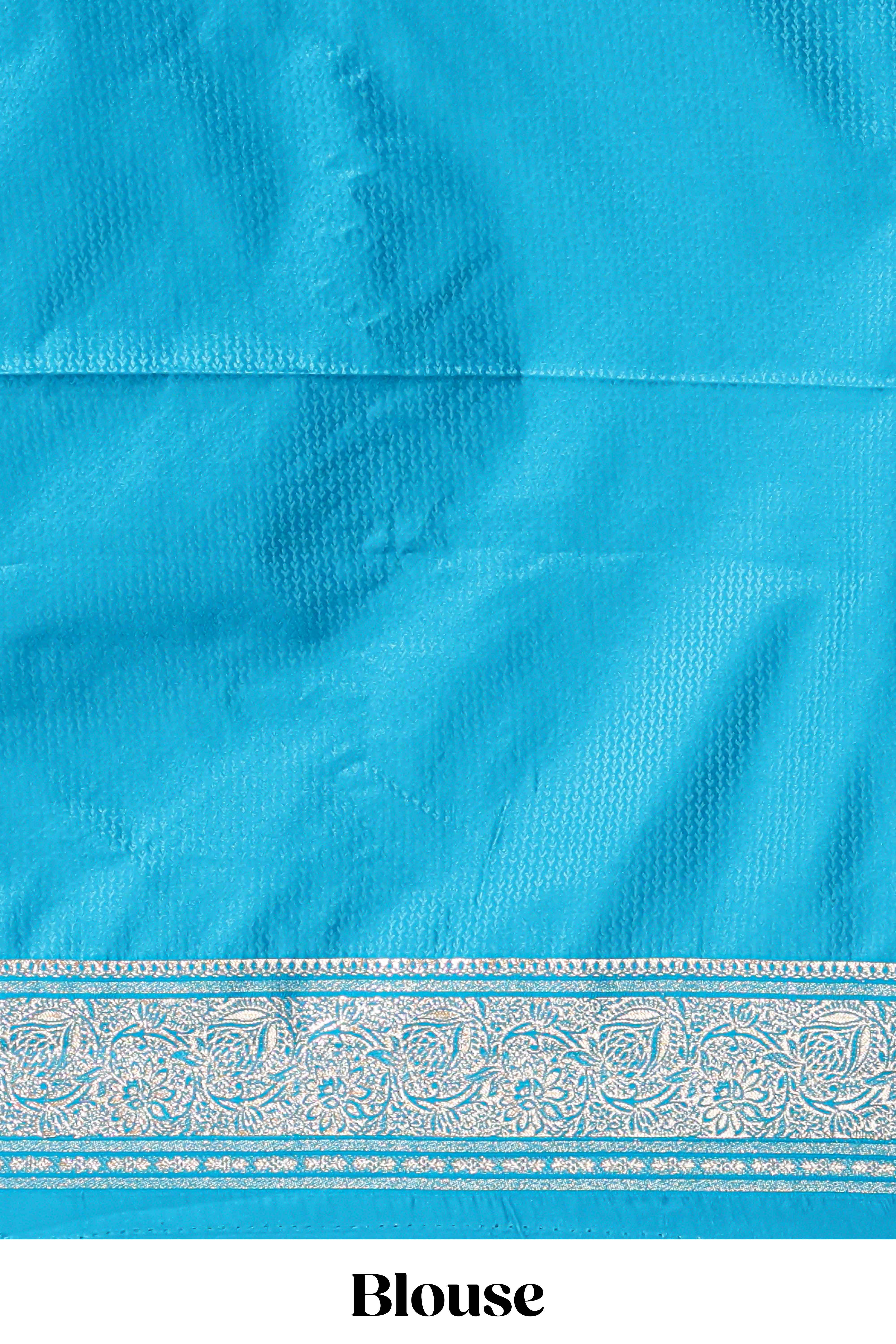 Blue shade floral designed banarasi silk saree with self zari border and blouse