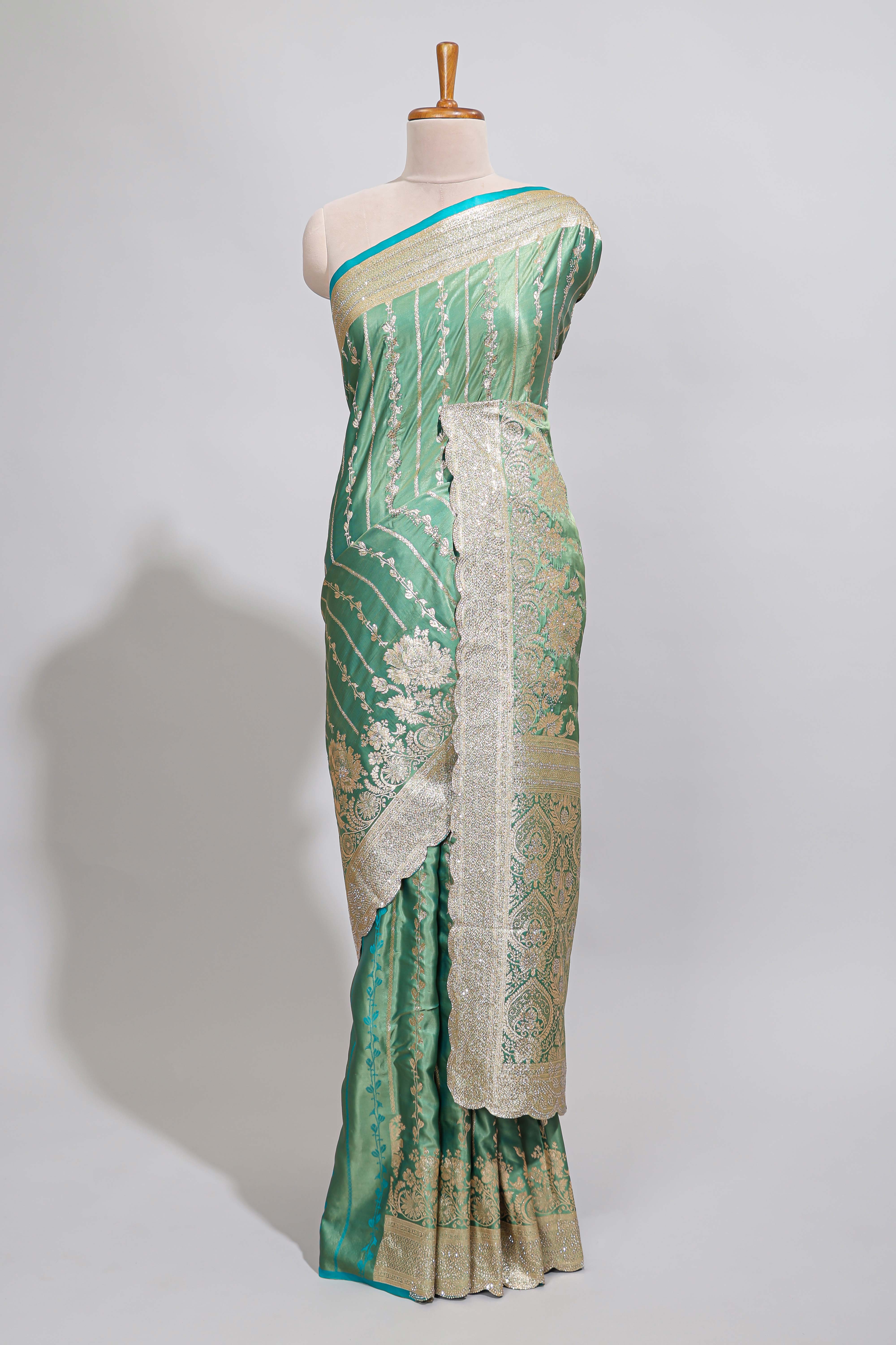 Sea green striped floral design banarasi silk saree with self zari border and blouse