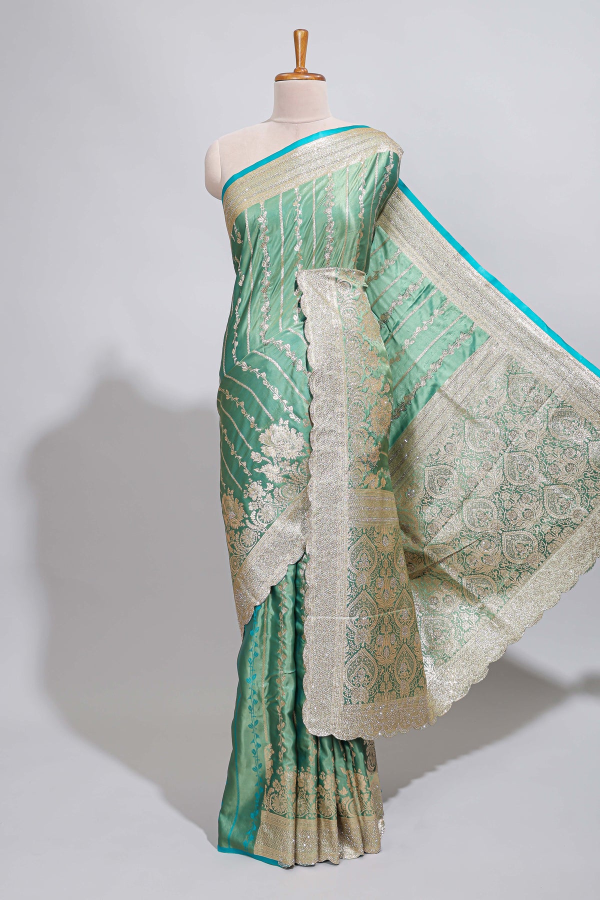 Sea green striped floral design banarasi silk saree with self zari border and blouse