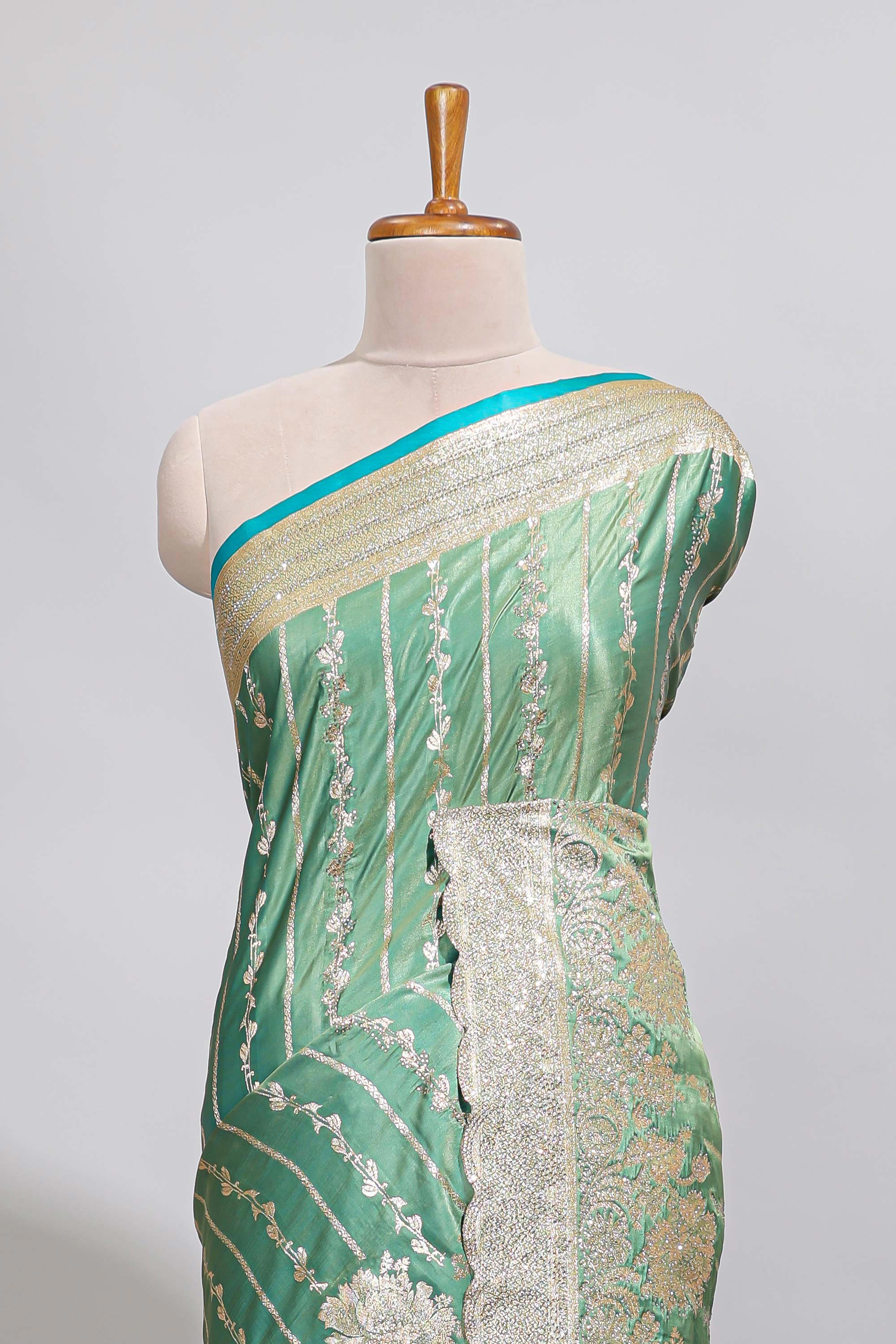 Sea green striped floral design banarasi silk saree with self zari border and blouse
