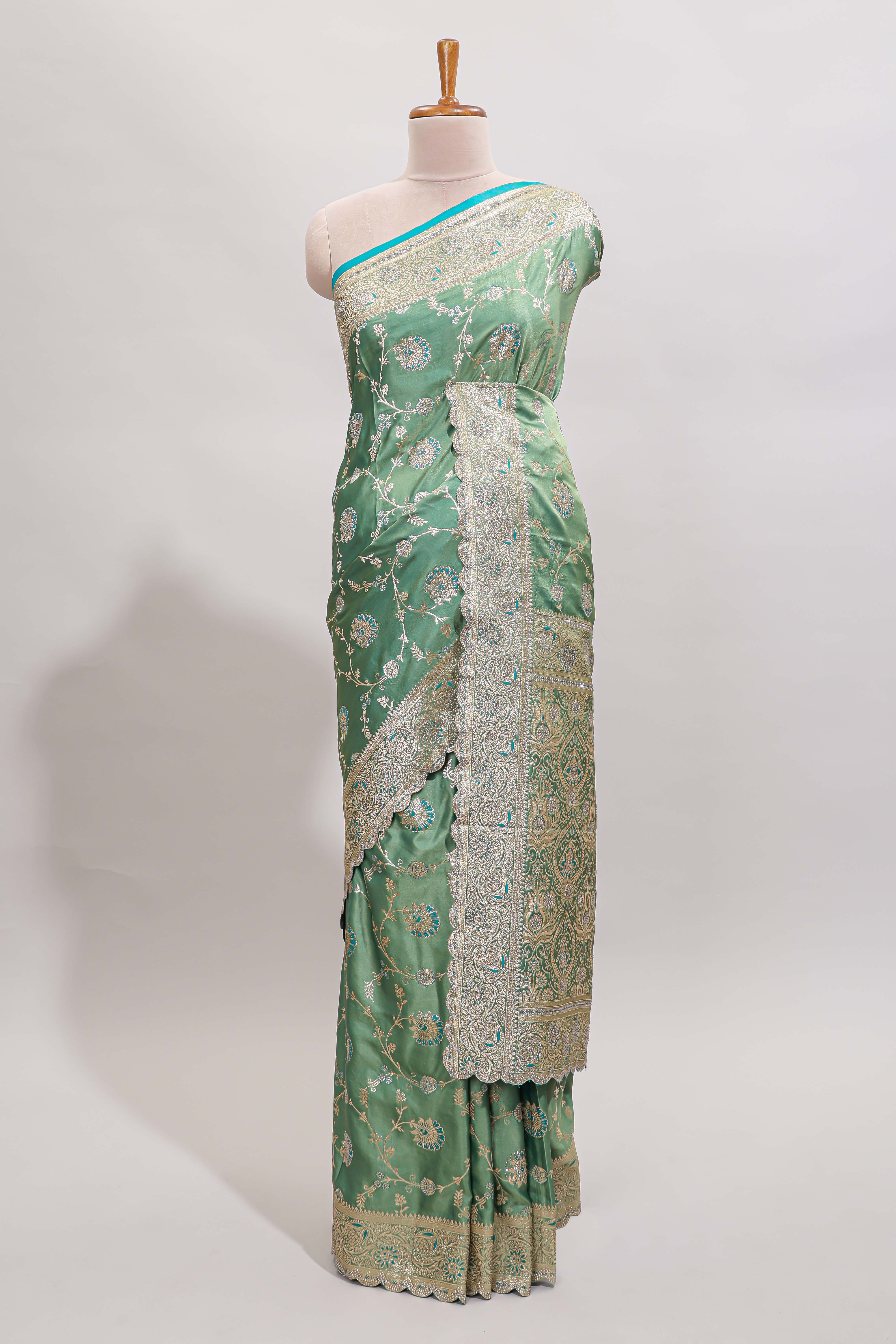 Sea green floral designed banarasi silk saree with self zari border and blouse