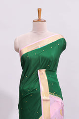 Green zari motifs design pure mysore silk saree with contrast border and zari motifs blouse
