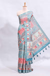 Blue floral design printed saree and self geometric design border and striped blouse