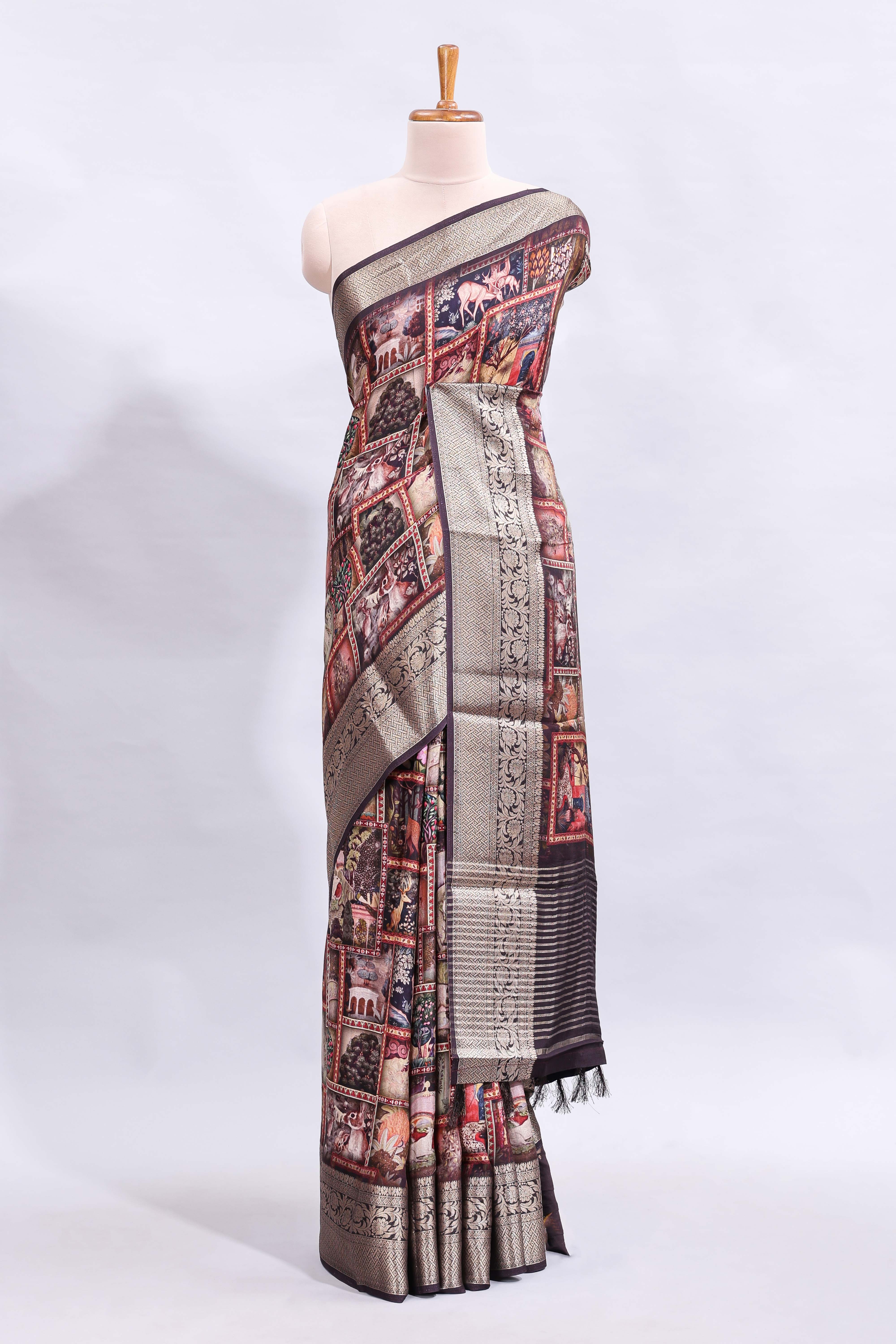 Maroon printed saree with traditional art motifs with contrast zari border and motifs blouse