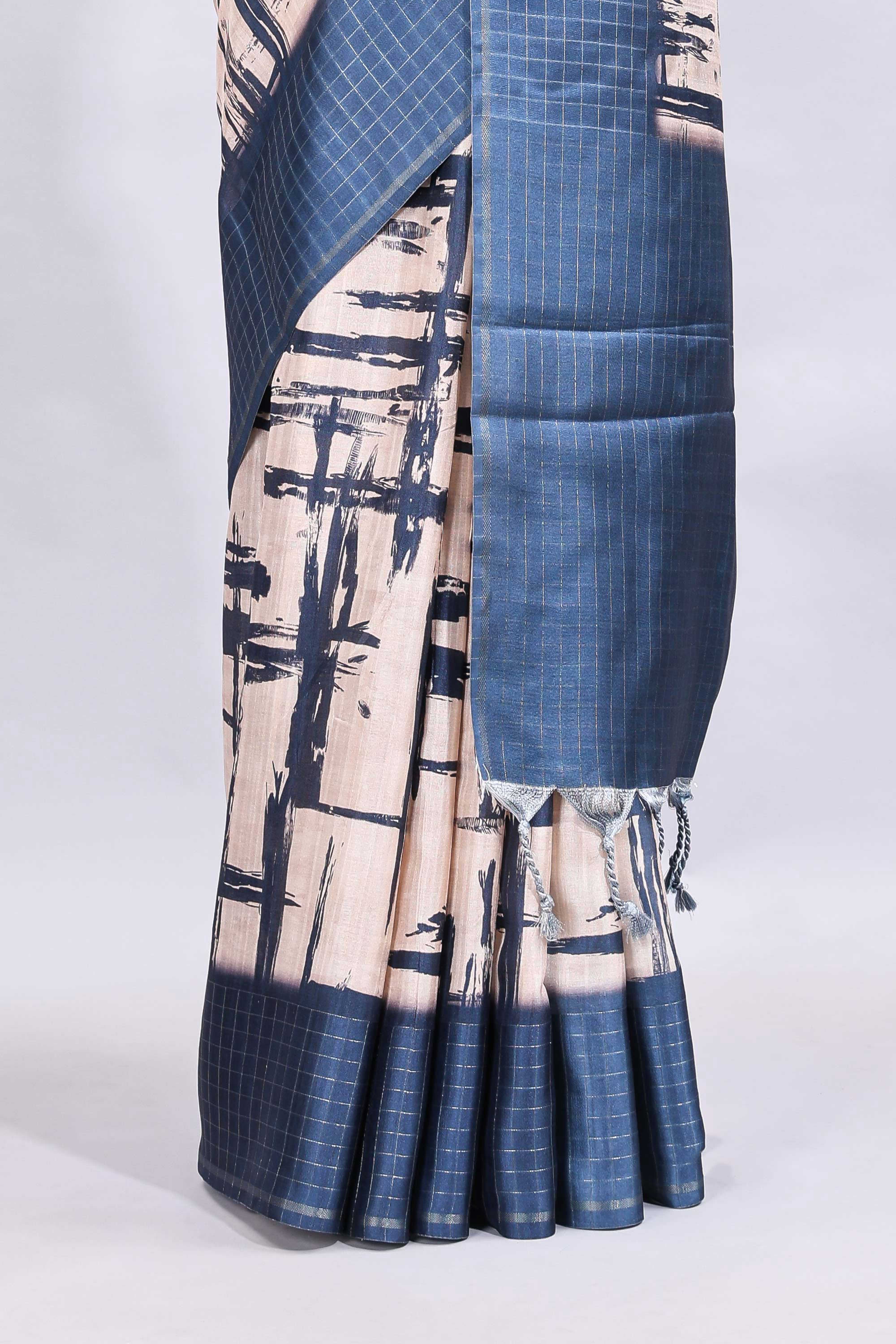 Cream abstract printed saree with contrast checked border and blouse