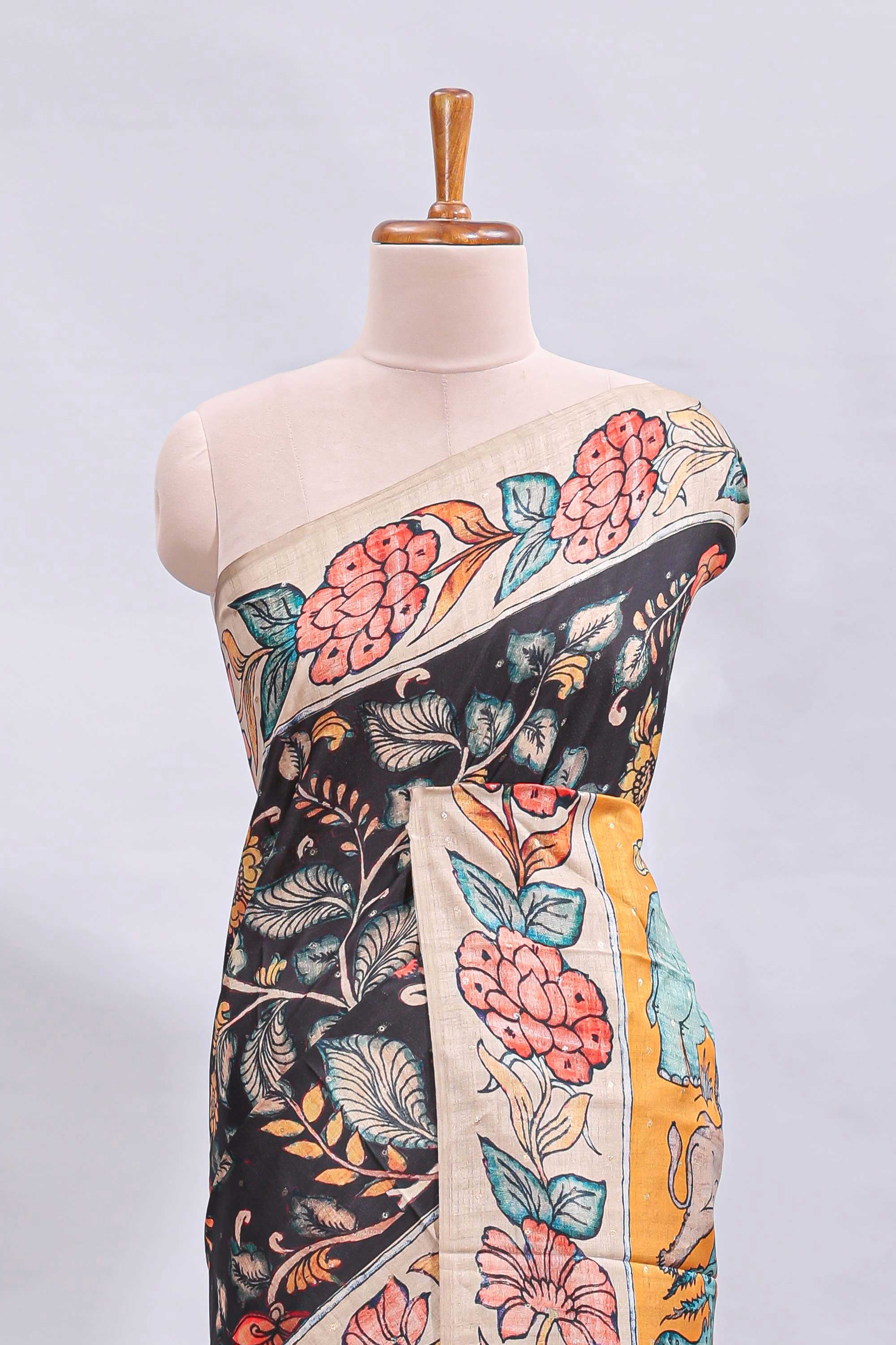 Black kalamkari style floral design printed saree with contrast border and blouse