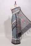 Grey ikkat style floral motifs tussar saree with contrast border and crane bird motif blouse