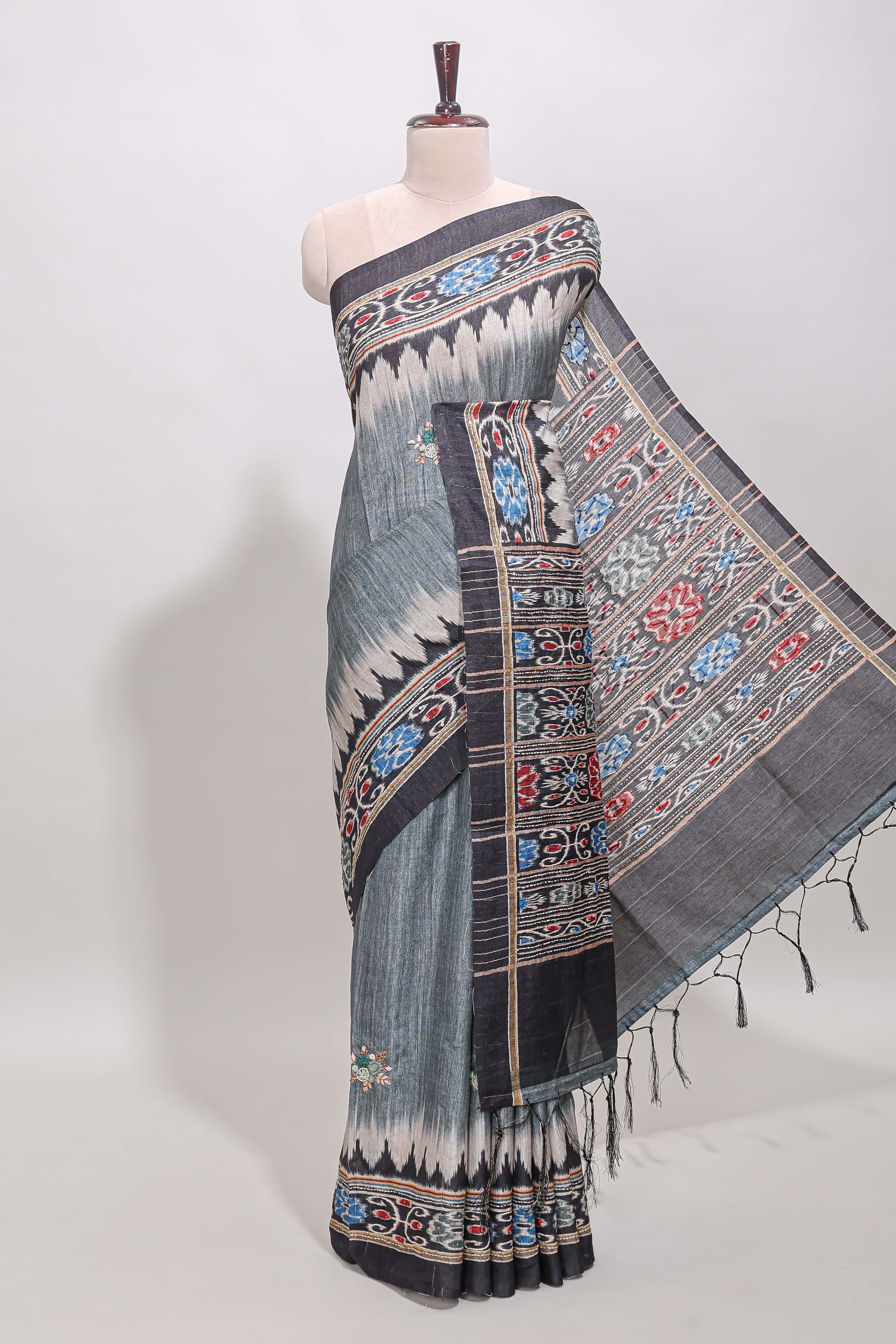 Grey ikkat style floral motifs tussar saree with contrast border and crane bird motif blouse