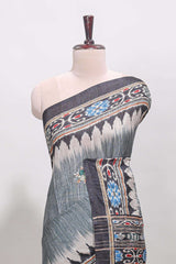 Grey ikkat style floral motifs tussar saree with contrast border and crane bird motif blouse