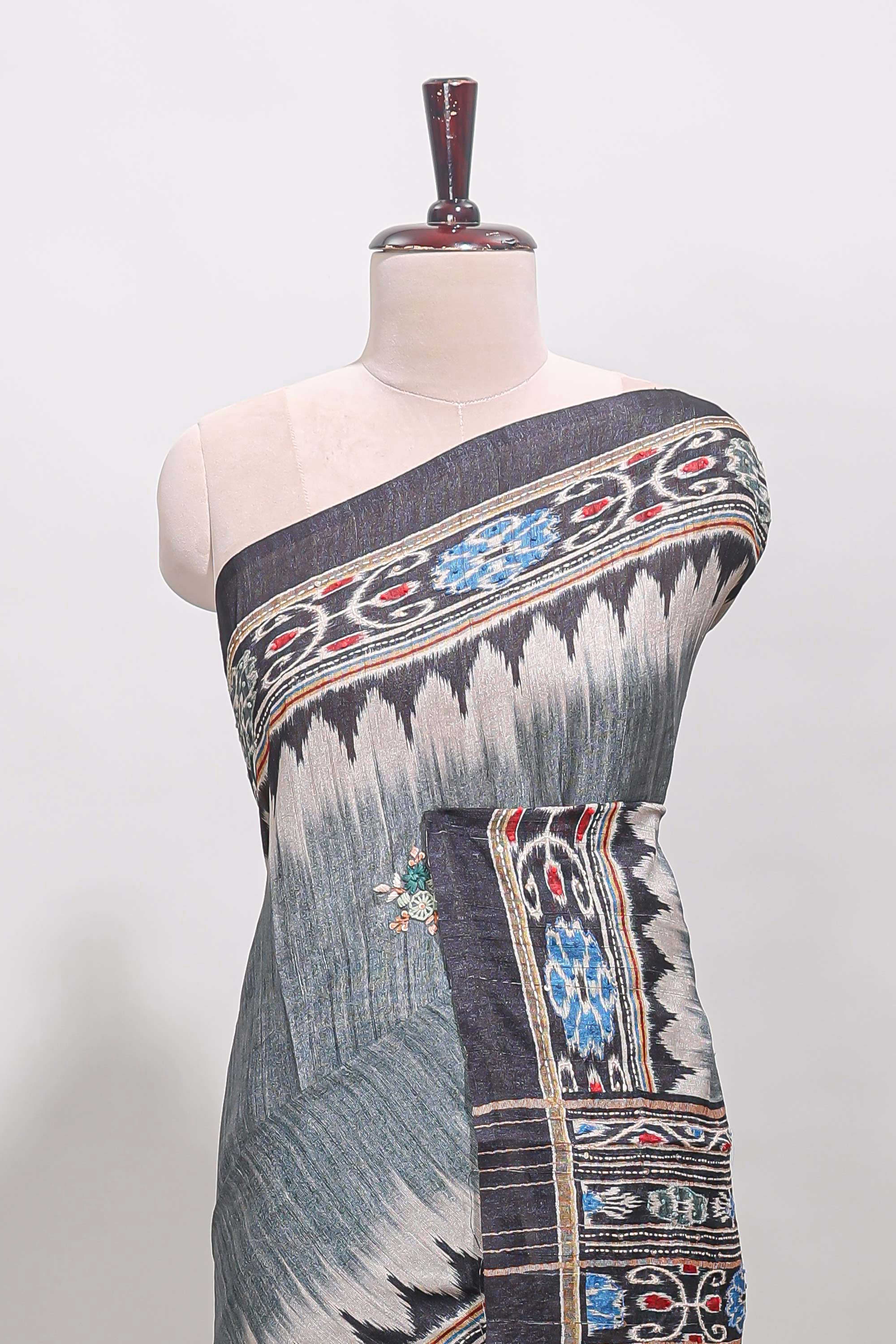 Grey ikkat style floral motifs tussar saree with contrast border and crane bird motif blouse