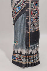 Grey ikkat style floral motifs tussar saree with contrast border and crane bird motif blouse