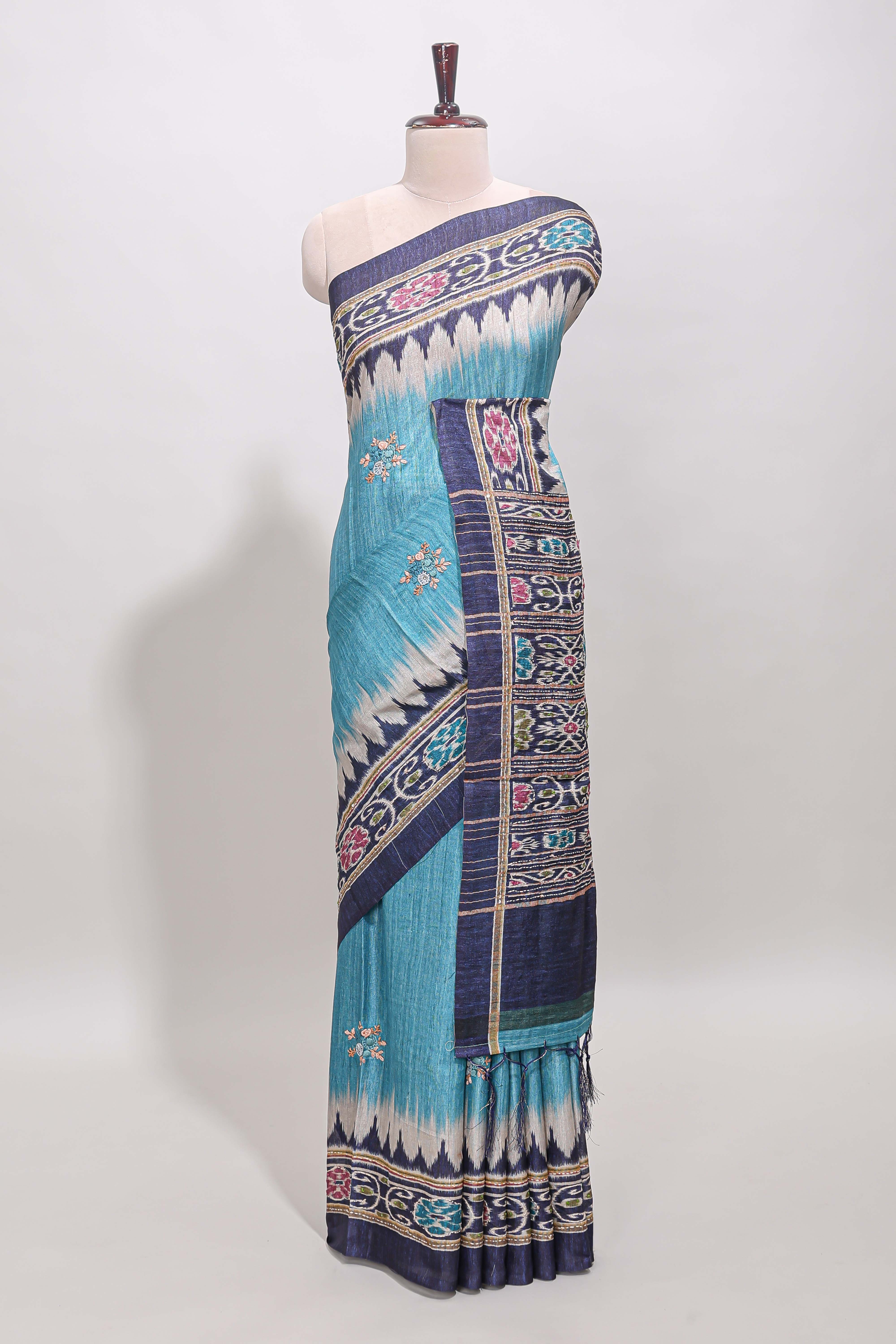 Blue ikkat style floral motifs tussar saree with contrast border and crane bird motif blouse