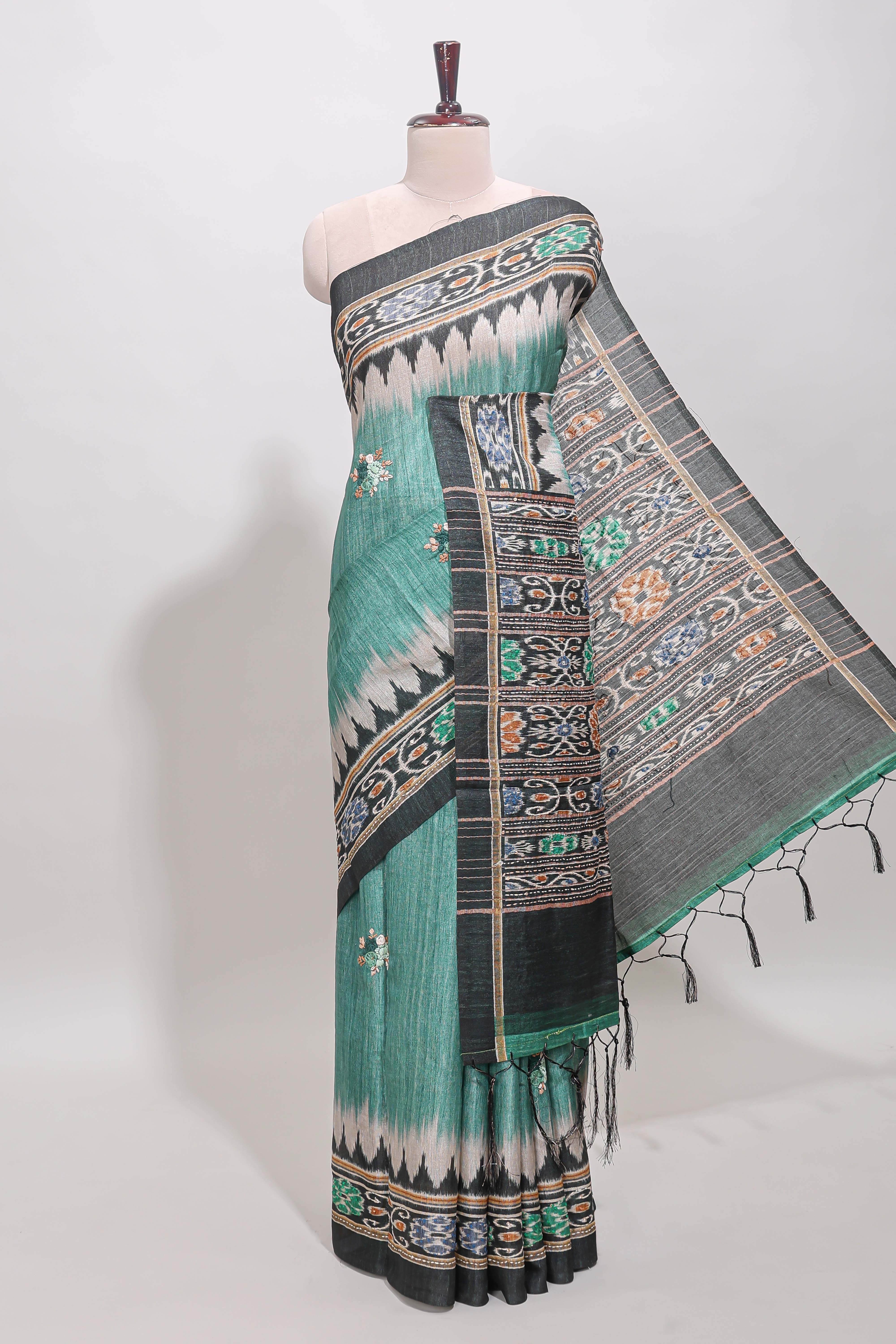 Green ikkat style floral motifs tussar saree with contrast border and crane bird motif blouse