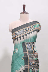 Green ikkat style floral motifs tussar saree with contrast border and crane bird motif blouse