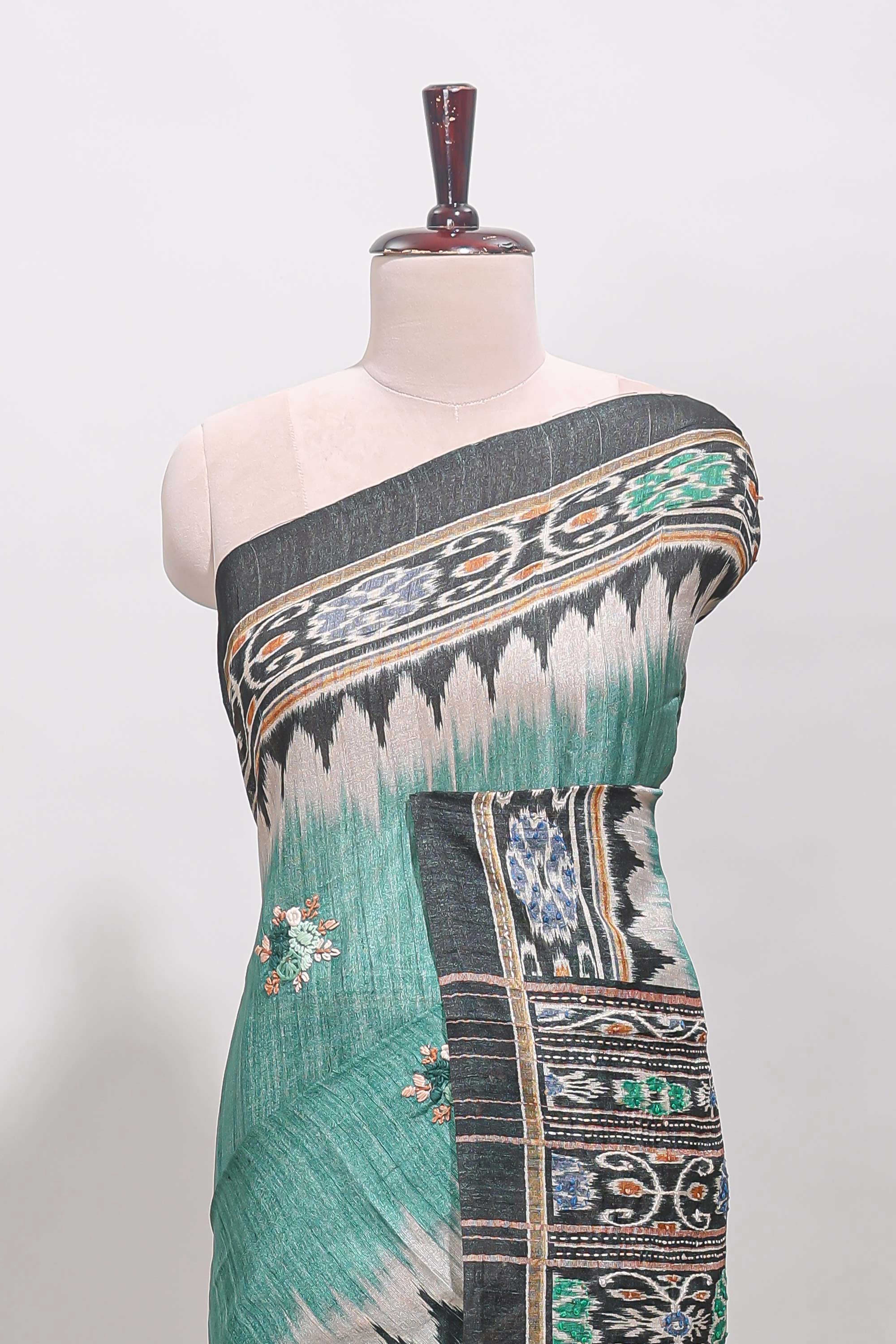 Green ikkat style floral motifs tussar saree with contrast border and crane bird motif blouse