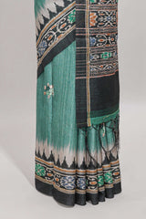 Green ikkat style floral motifs tussar saree with contrast border and crane bird motif blouse