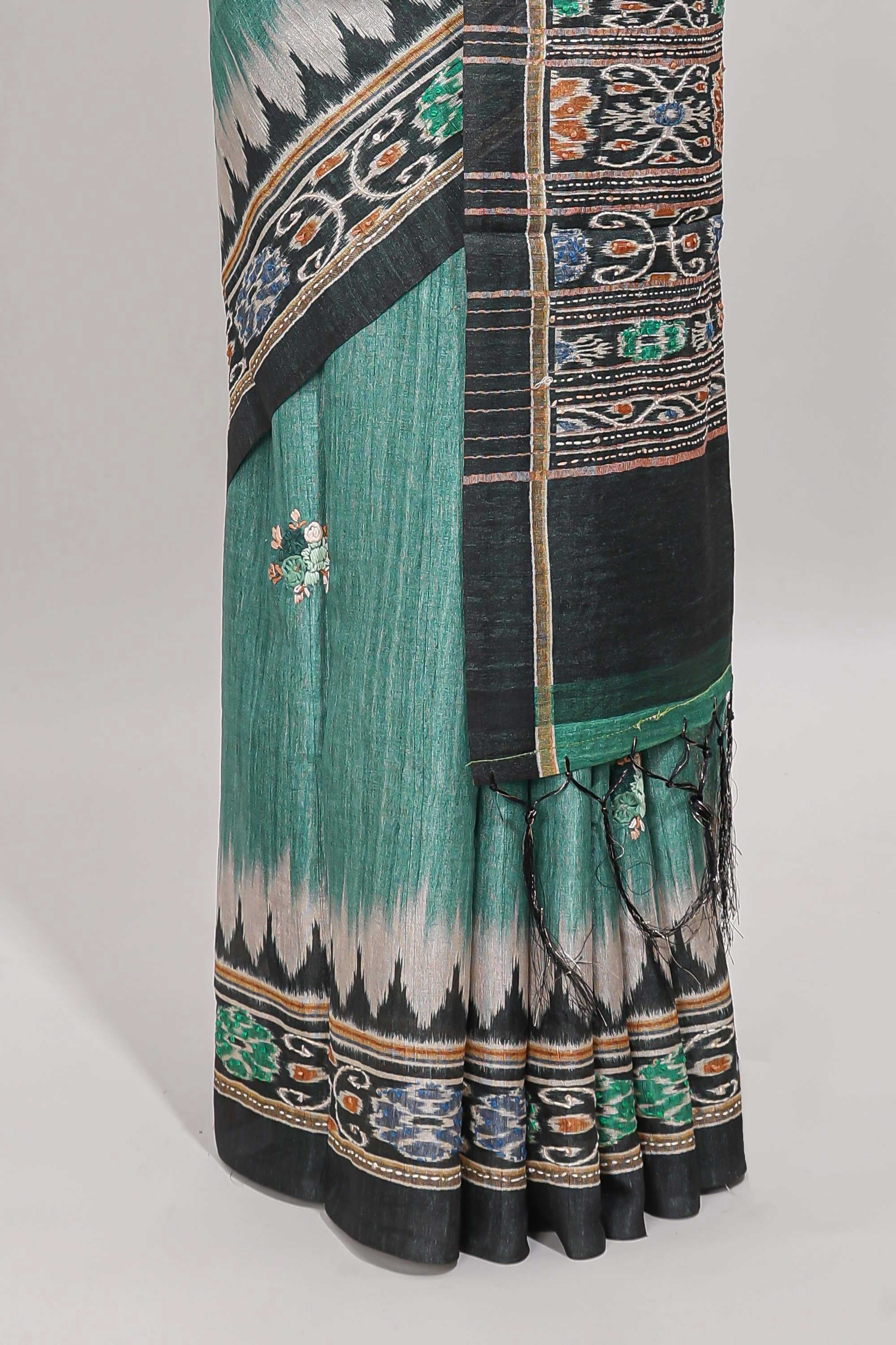 Green ikkat style floral motifs tussar saree with contrast border and crane bird motif blouse
