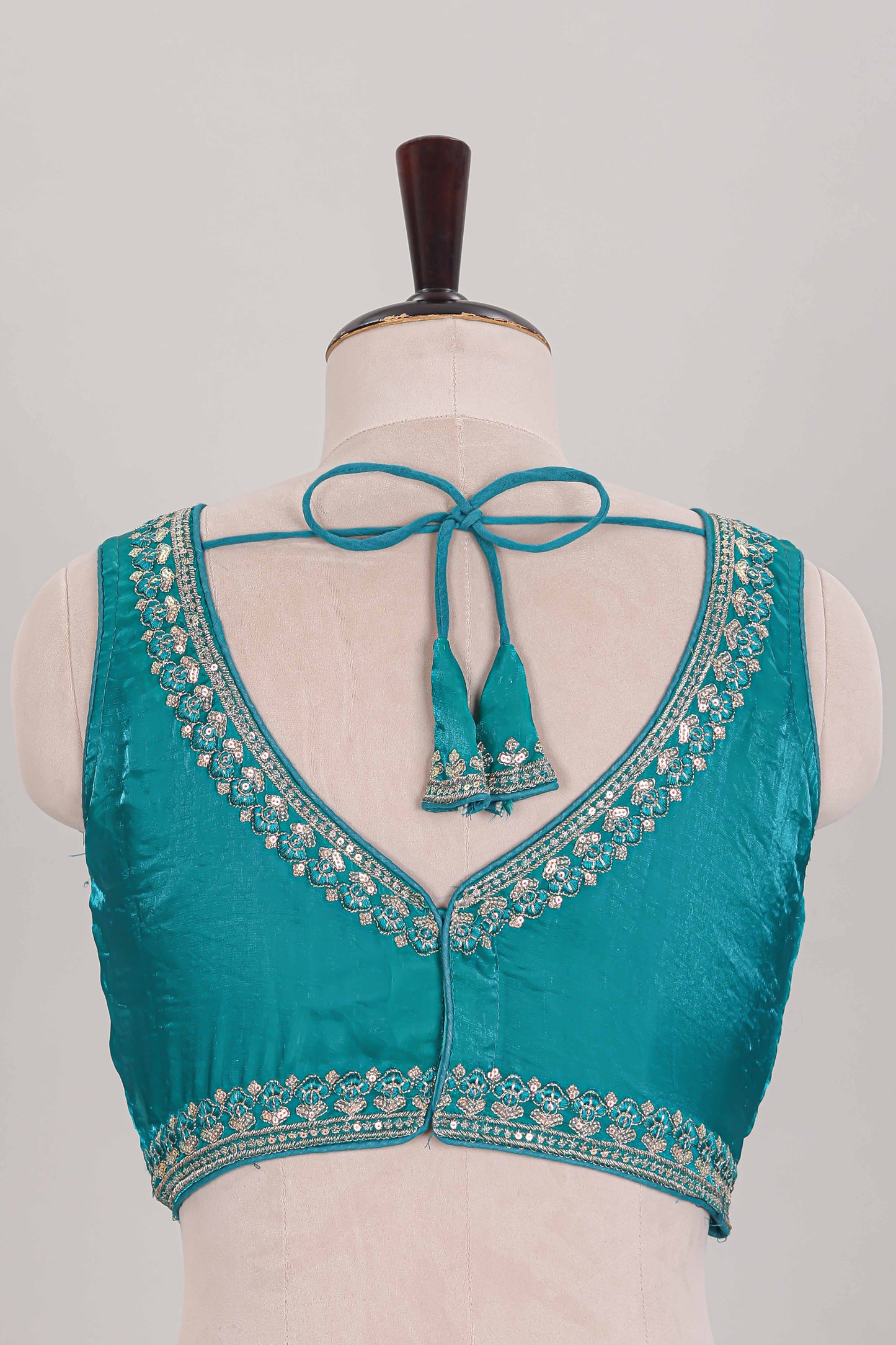 Turquoise green embroidery work readymade designer blouse, sleeveless sweatheart neck with back tassels